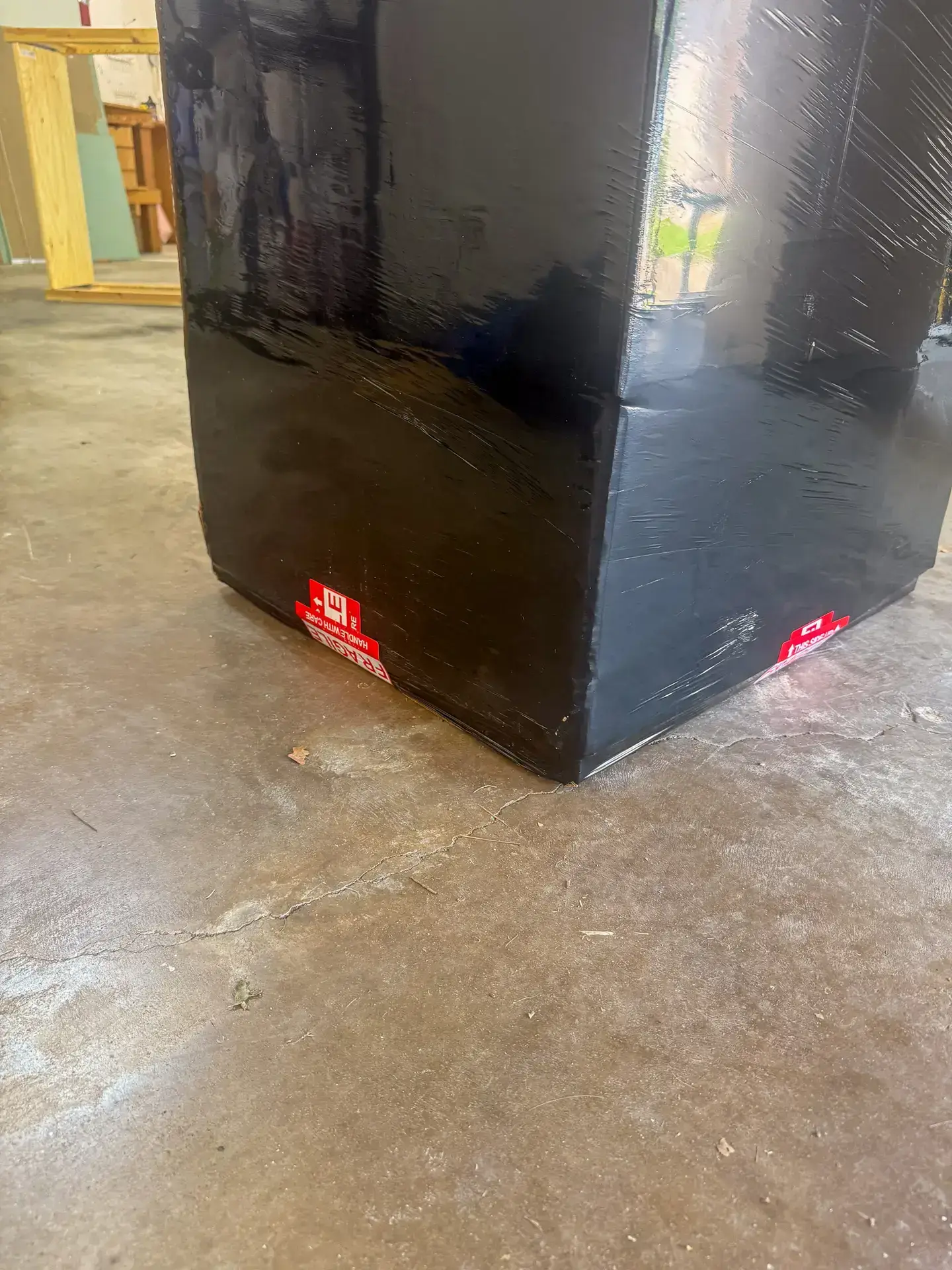 Full service movers in Austin TX wrapping furniture in stretch wrap
