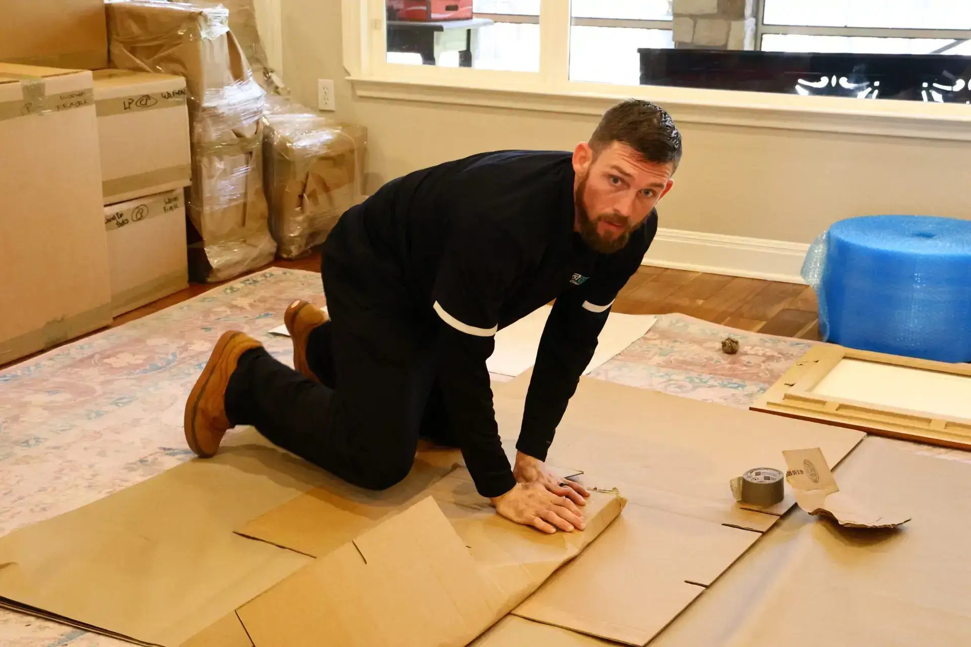 First Class mover preparing wrapping materials