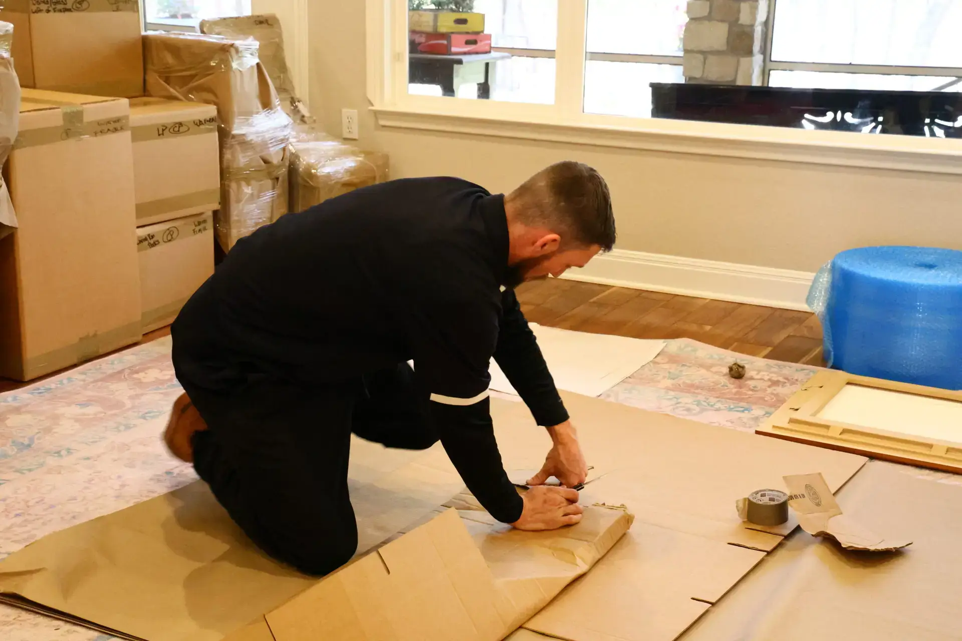 First Class mover preparing packing materials