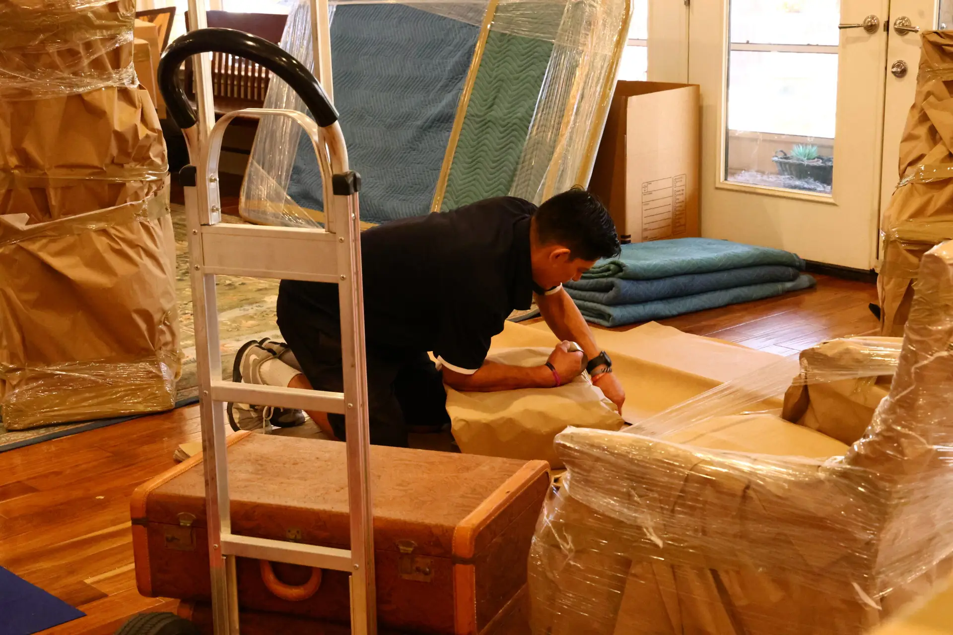 Moving professional preparing protective wrapping