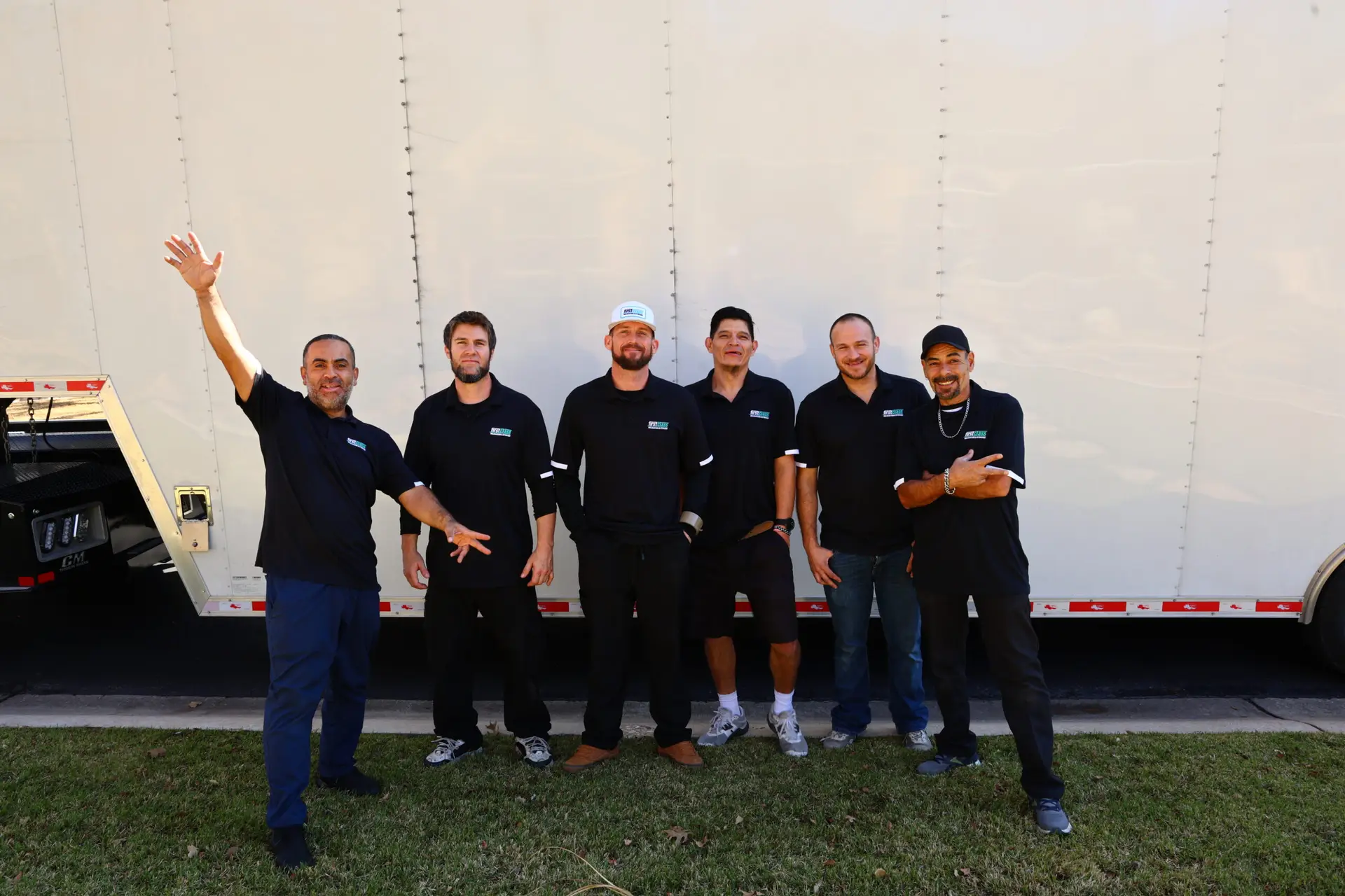 First Class Relocation mover carrying furniture with moving straps in Austin TX